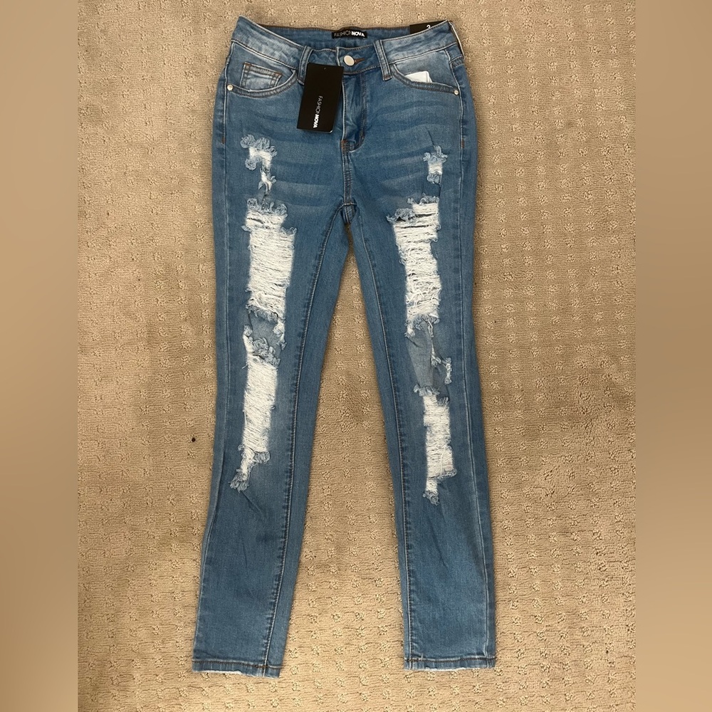 Light blue wash skinny ripped jeans